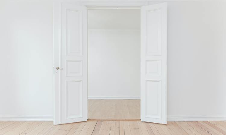 Open white double door to a new job